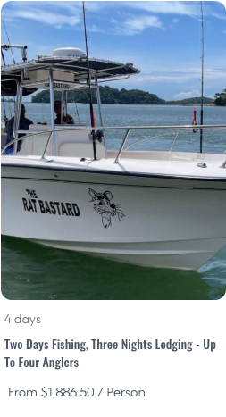 2D3L - Panama Sport Fishing Charters White fishing charter boat named 'The Rat Bastard' with a cartoon rat logo, on blue water with islands in the background