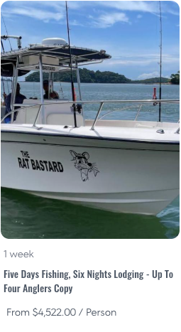 5D6L - Panama Sport Fishing Charters Motorboat named The Rat Bastard with a cartoon rat logo on the hull, on blue water under a clear sky.