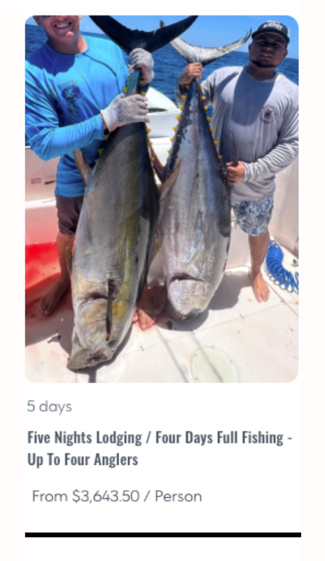 Two fishermen on a boat proudly display two large tuna caught on a deep-sea fishing trip, with the blue ocean behind them.